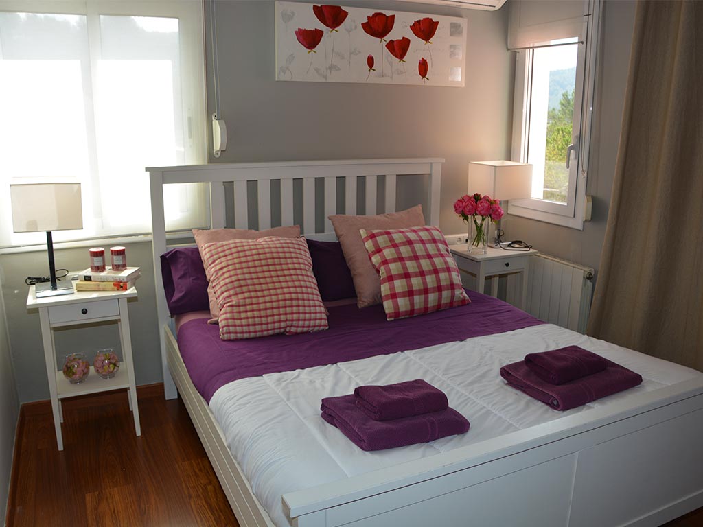 holiday villas in sitges and their bedroom with double bed