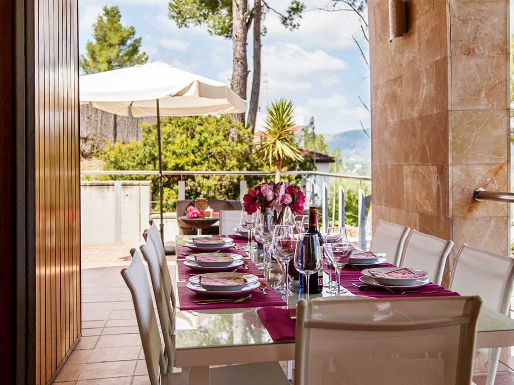 Dining area under a ceiling in our Sitges villas for rent